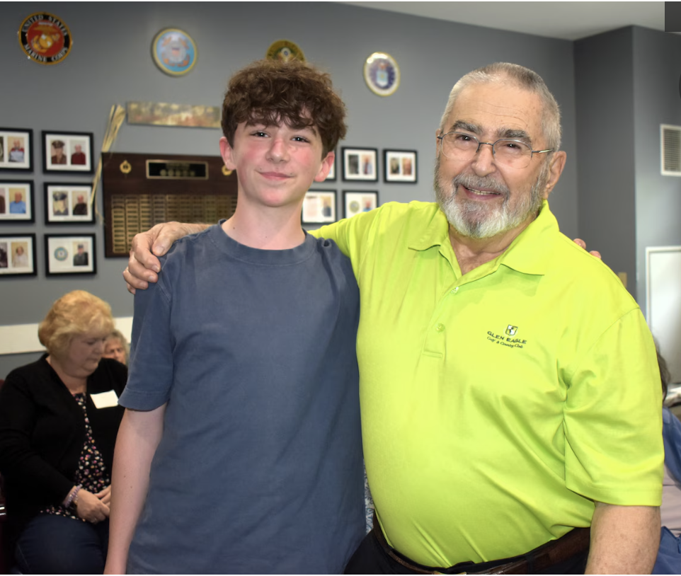 Student and older man smiling