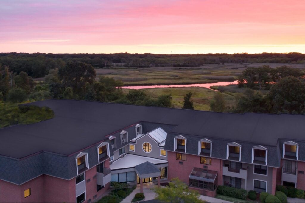 The exterior of Anchor Bay East Providence at sunset.