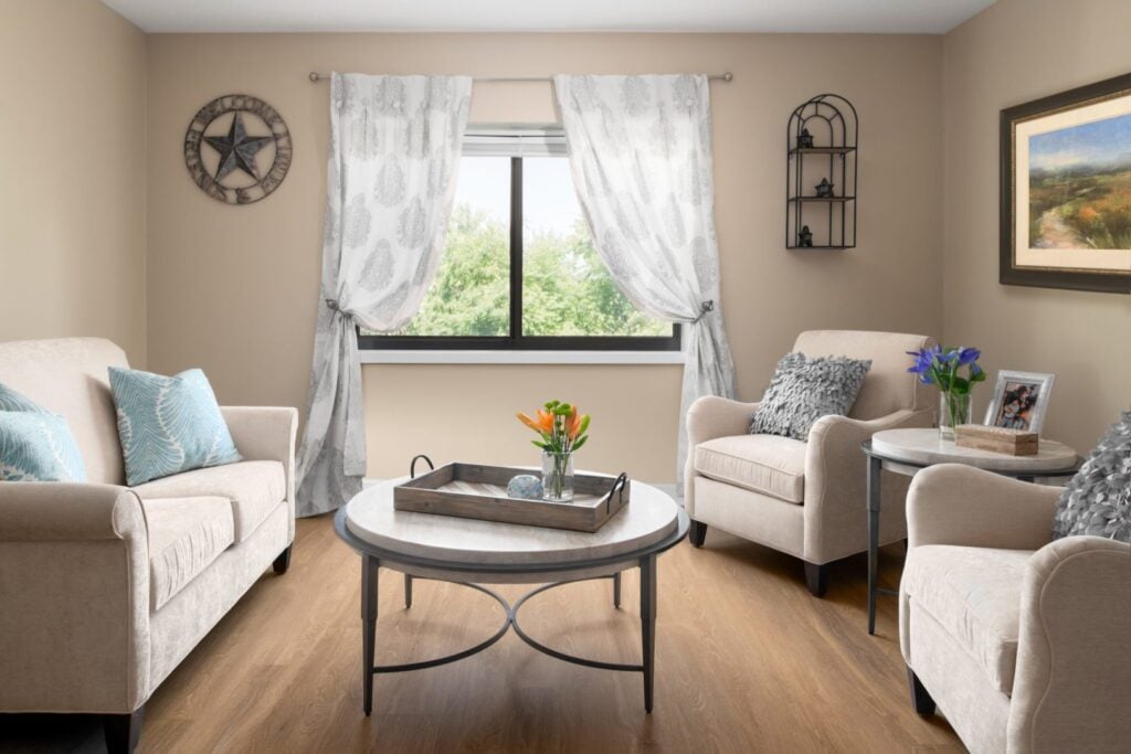 A bright seating area in a Anchor Bay East Providence room.