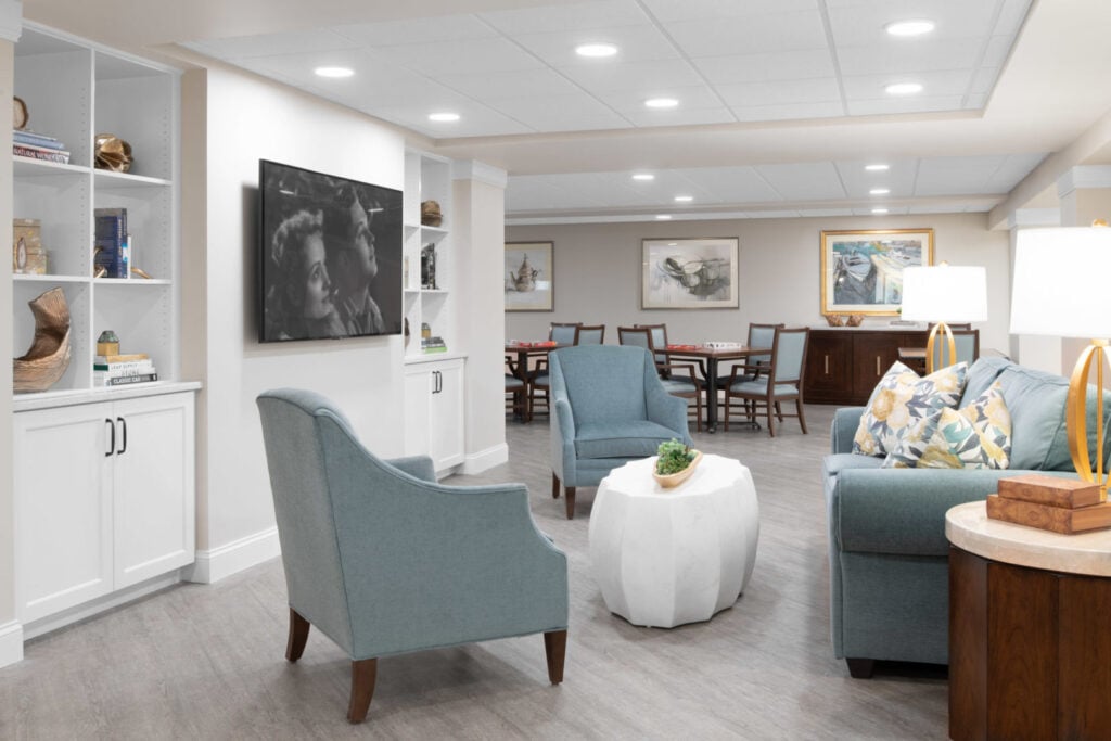 A living room with seating at Anchor Bay Greenwich Assisted Living in East Greenwich.