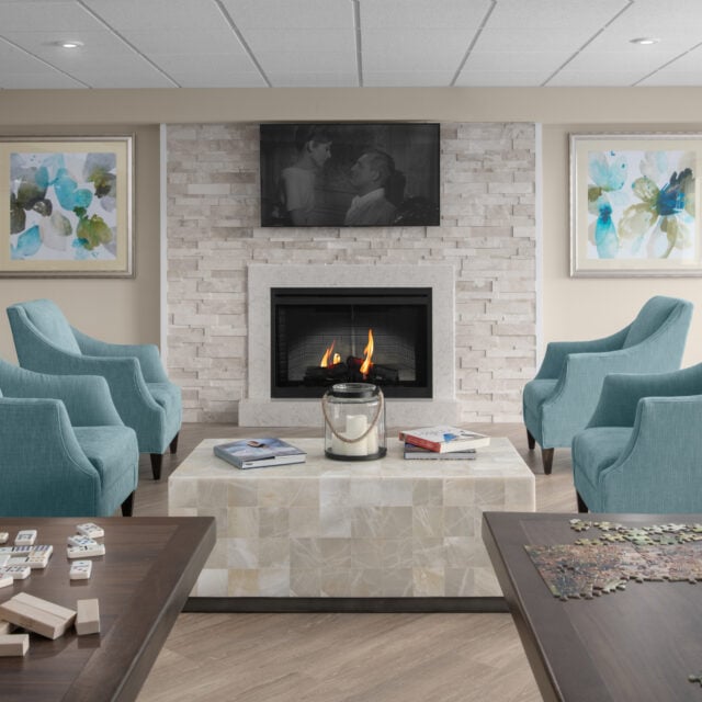 An head on shot of the living room inside the Compass Memory Support Neighborhood at Anchor Bay East Providence.